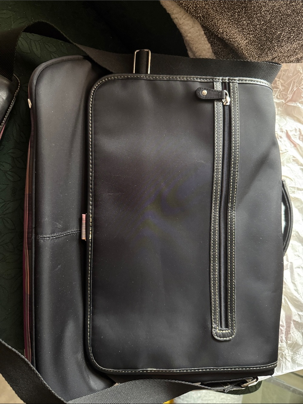 Very gently used Targus Laptop/ Messenger Bag. Pink plaid design.